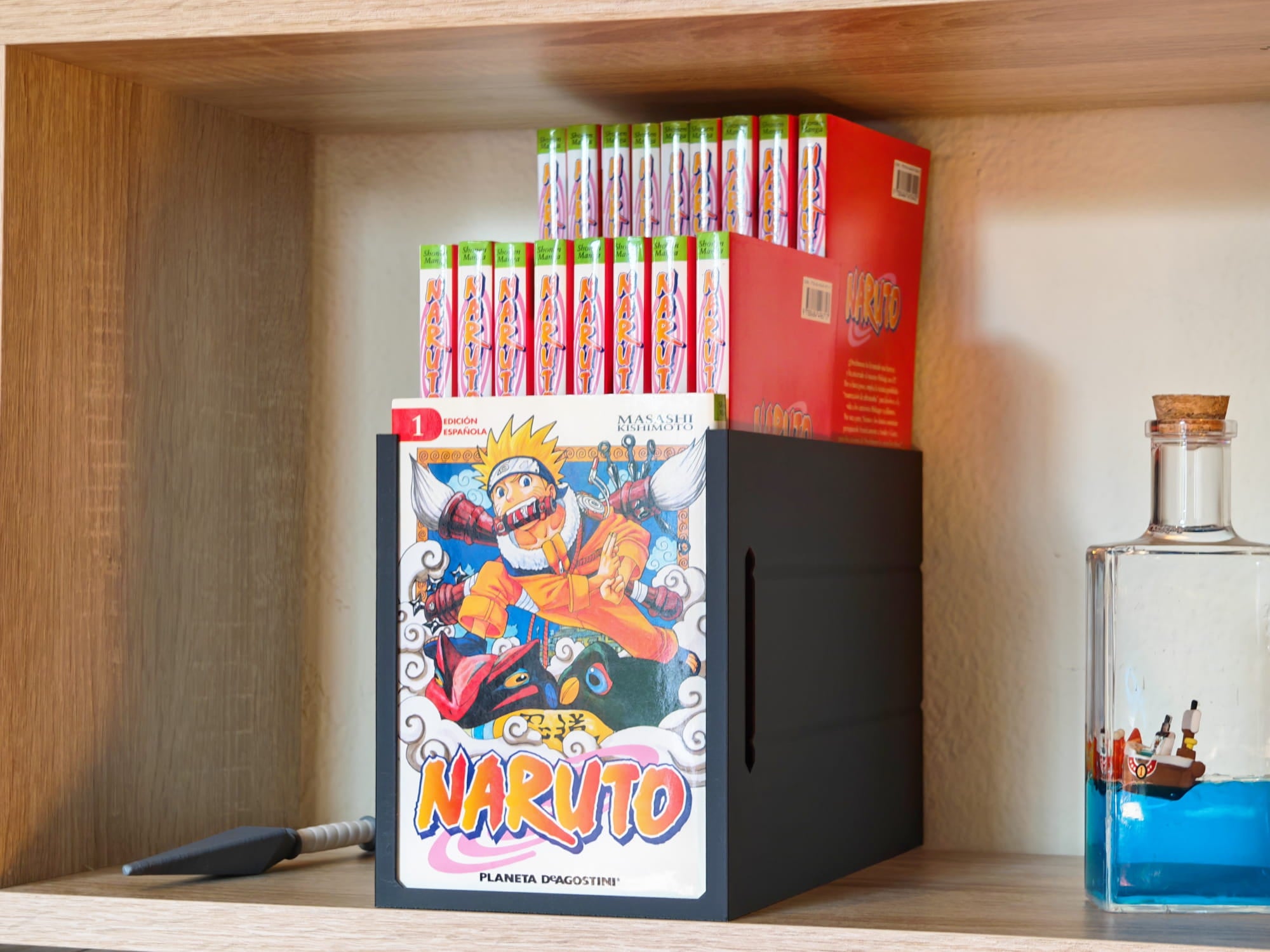 Exhibidor para manga con elevador de doble altura