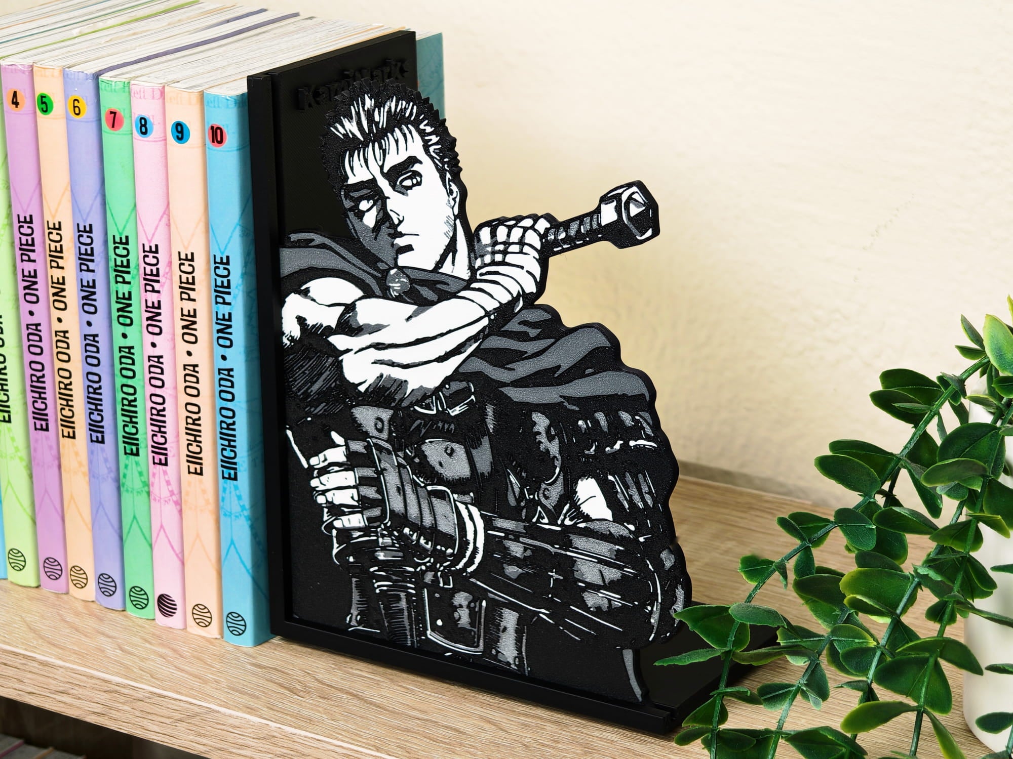 Sujetalibros de Guts de joven