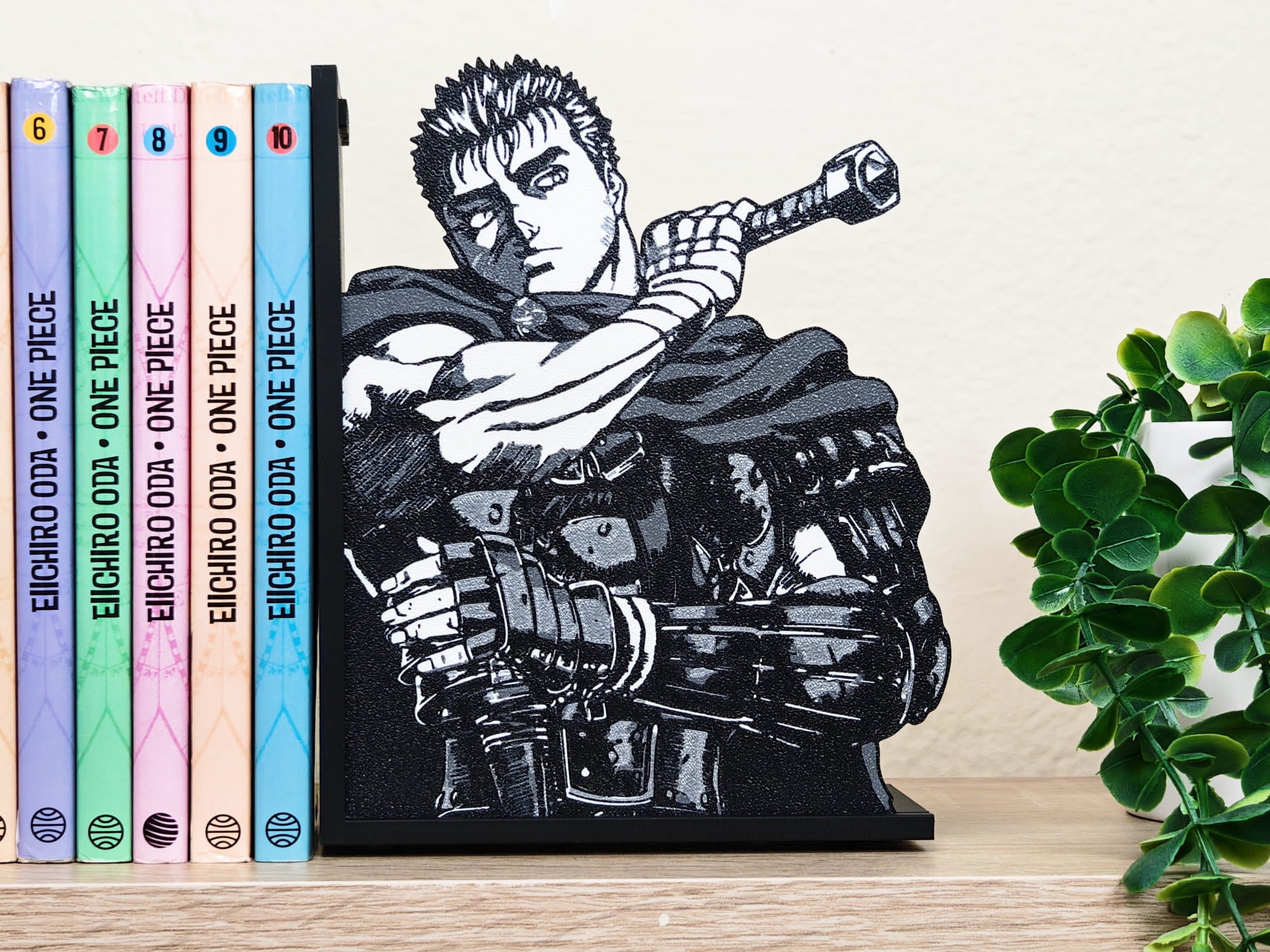 Sujetalibros de Guts de joven