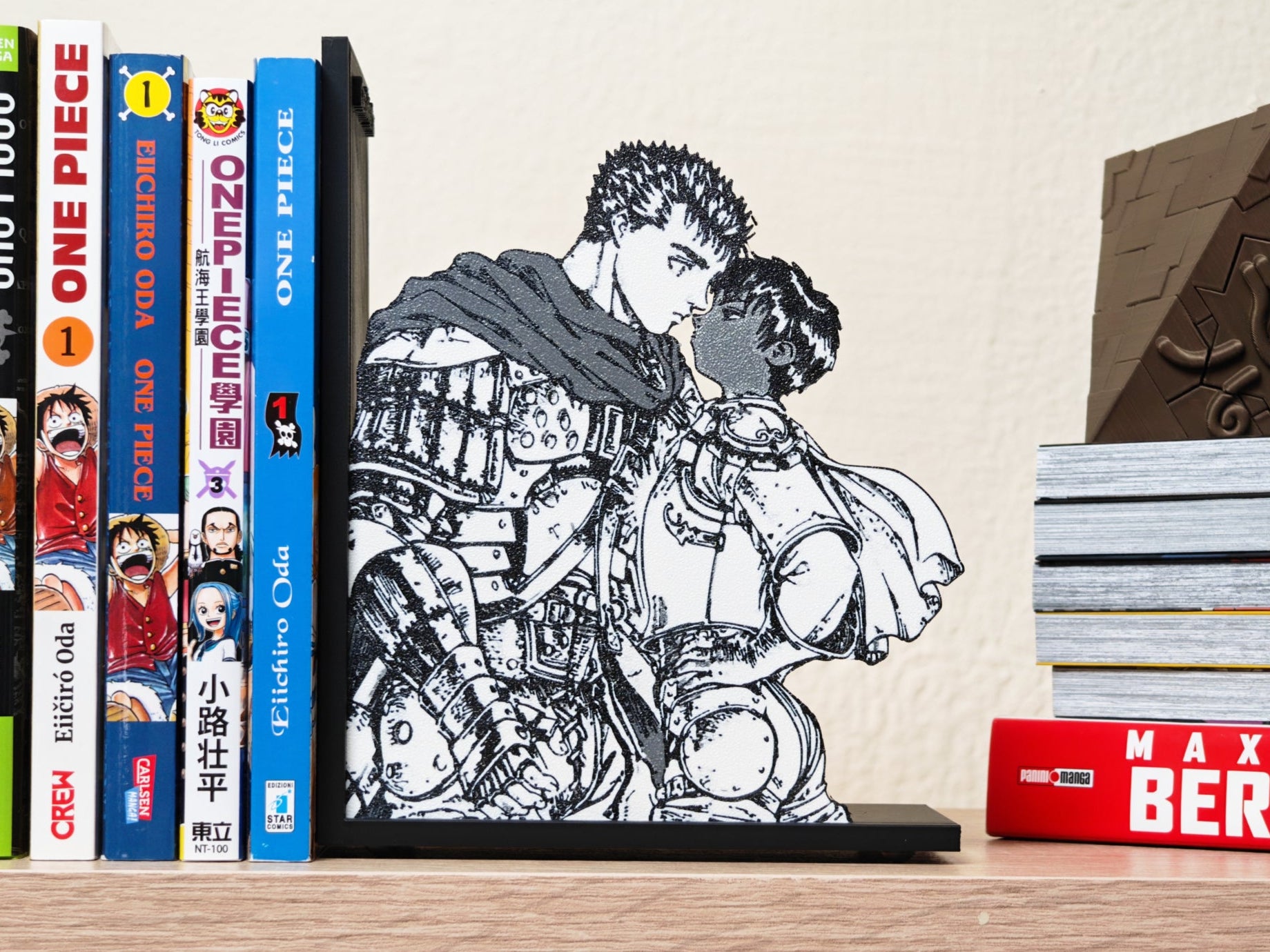 Sujetalibros de Guts y Casca