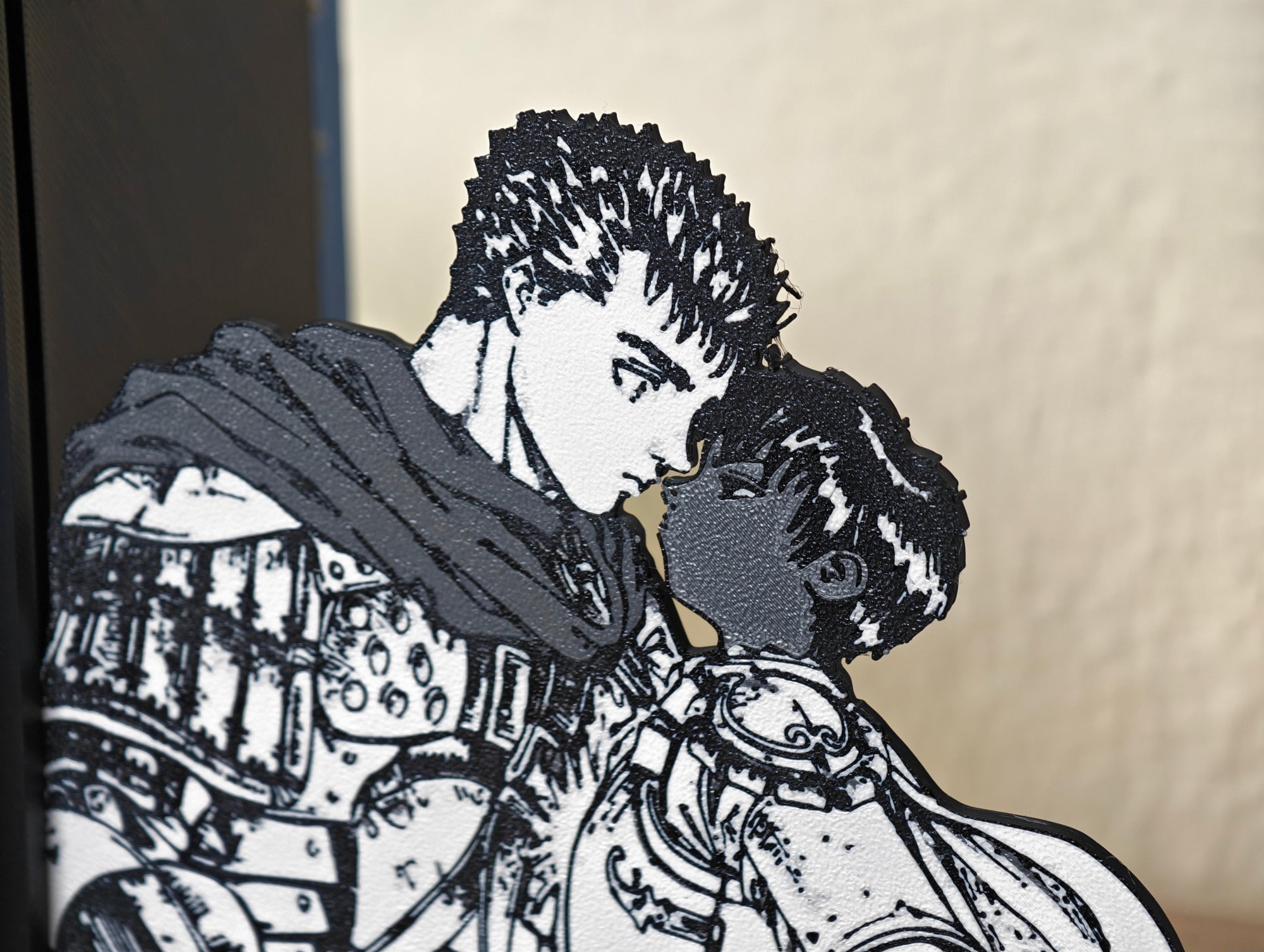 Sujetalibros de Guts y Casca