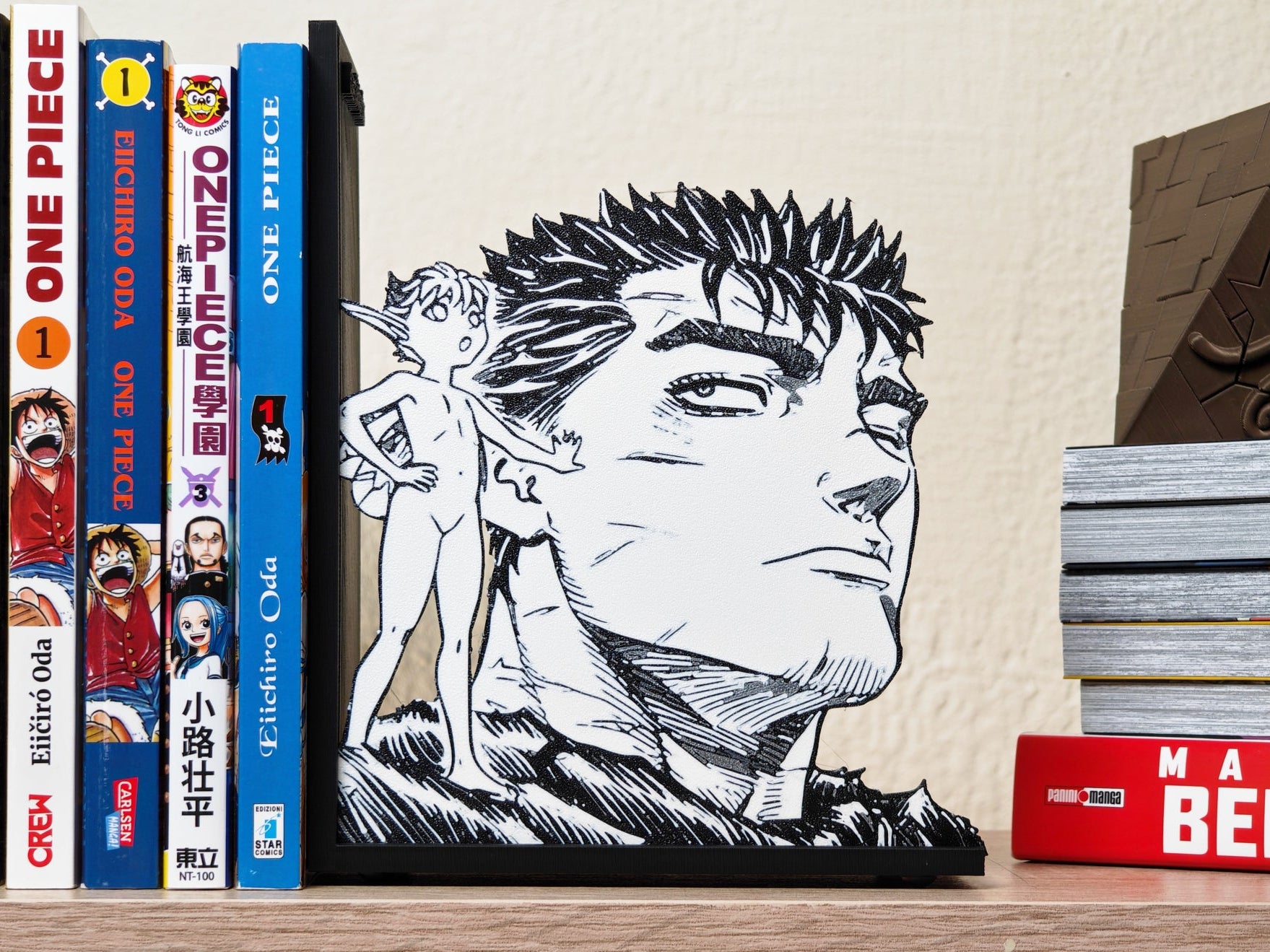 Sujetalibros de Guts y Puck