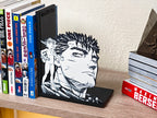 Sujetalibros de Guts y Puck