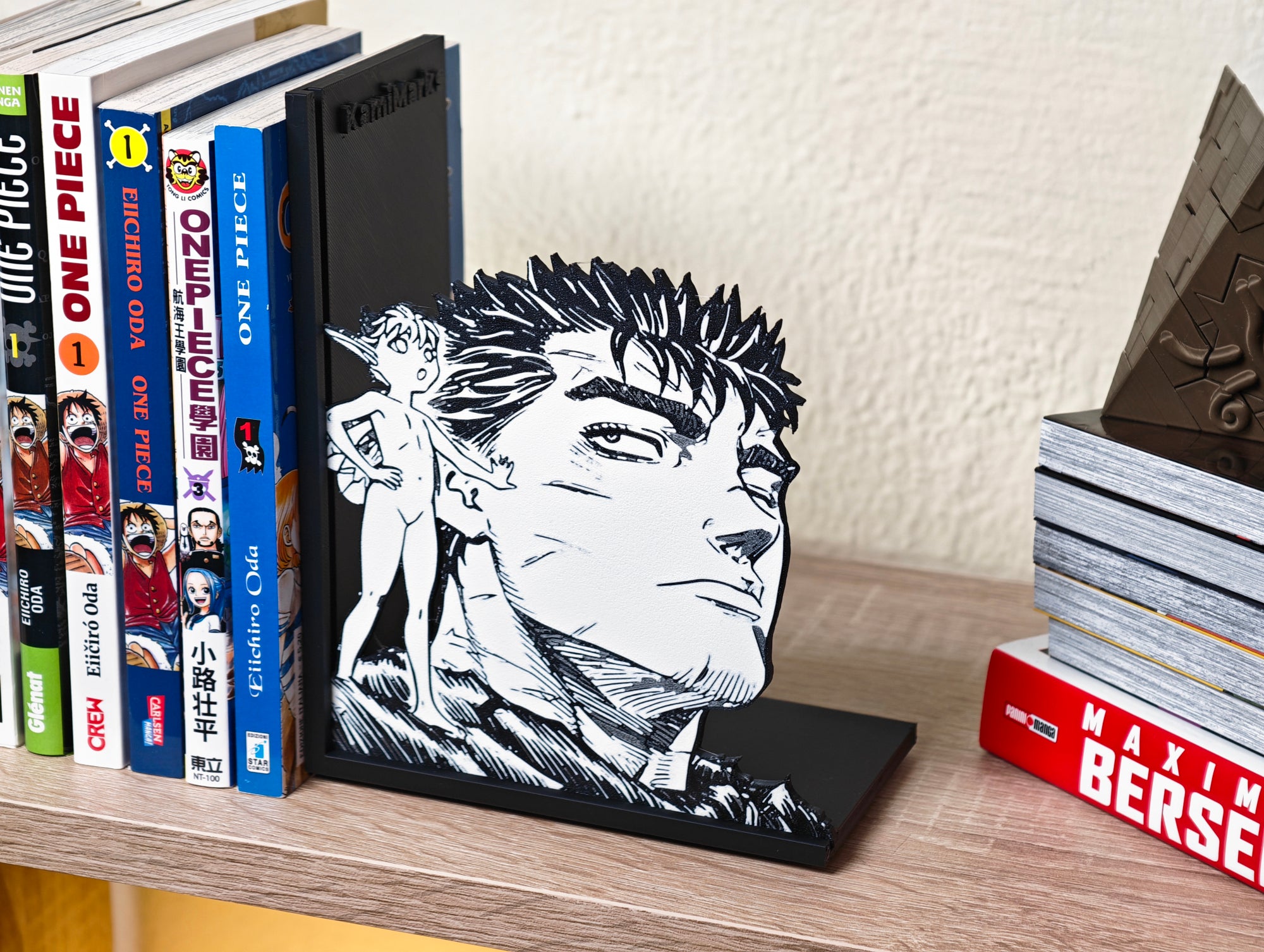 Sujetalibros de Guts y Puck