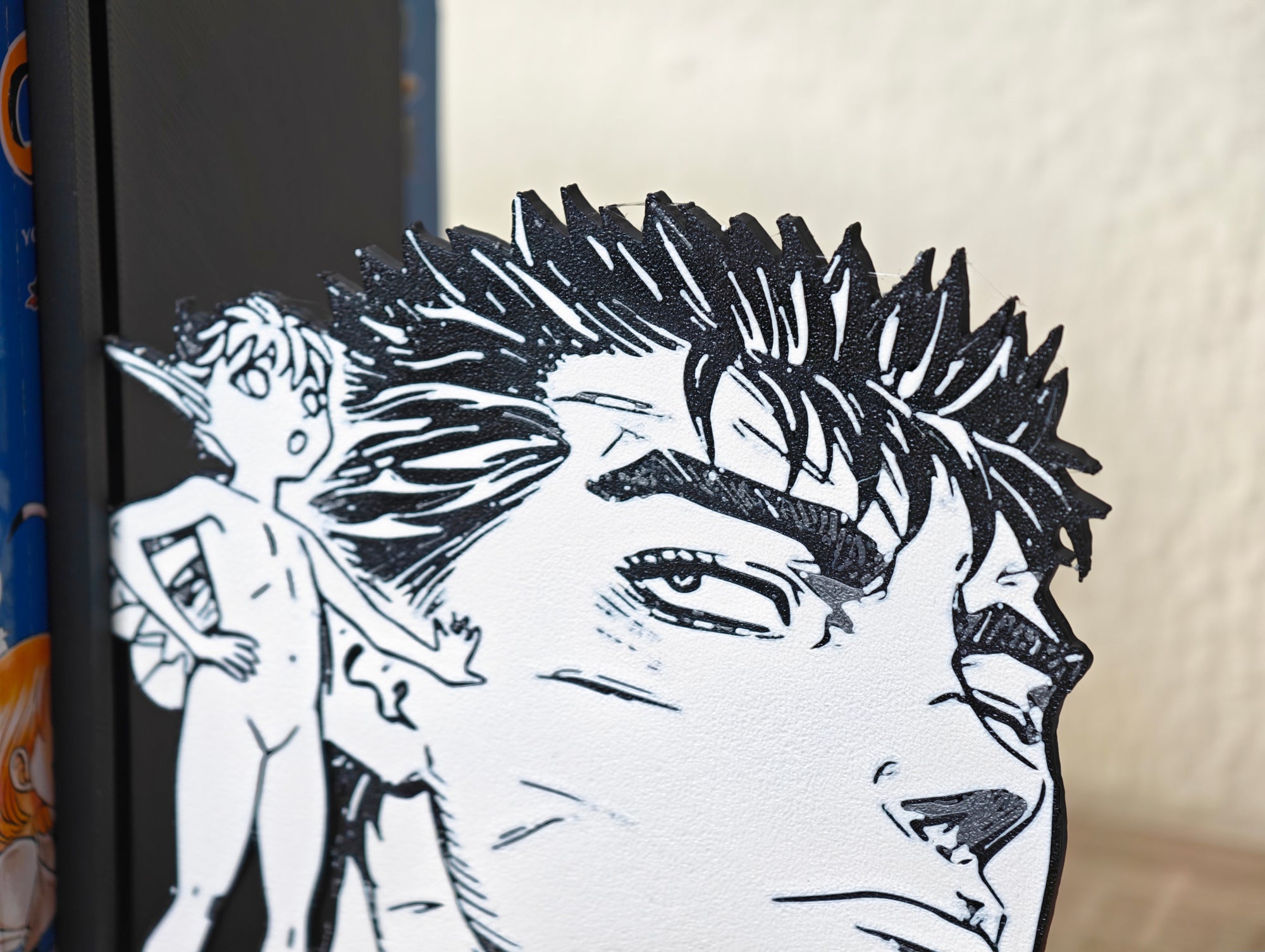 Sujetalibros de Guts y Puck