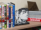 Sujetalibros de Guts y Puck