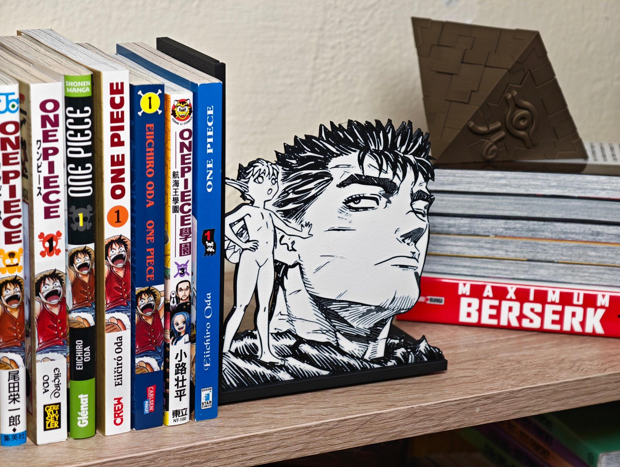 Sujetalibros de Guts y Puck