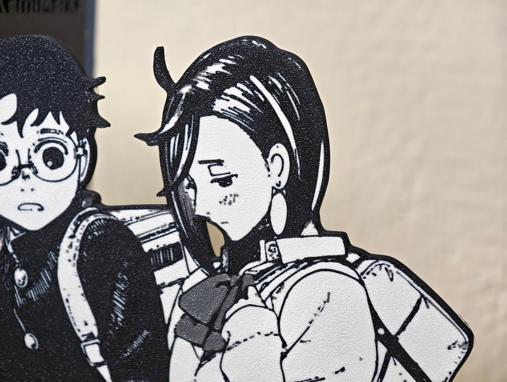 Sujetalibros de Momo y Okarun de la mano