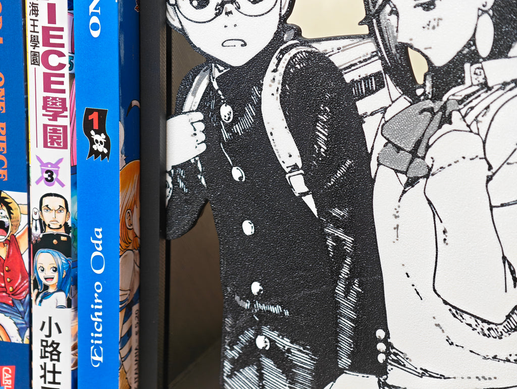 Sujetalibros de Momo y Okarun de la mano