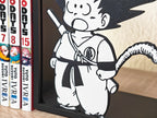 Sujetalibros de Goku flipando con tu biblioteca