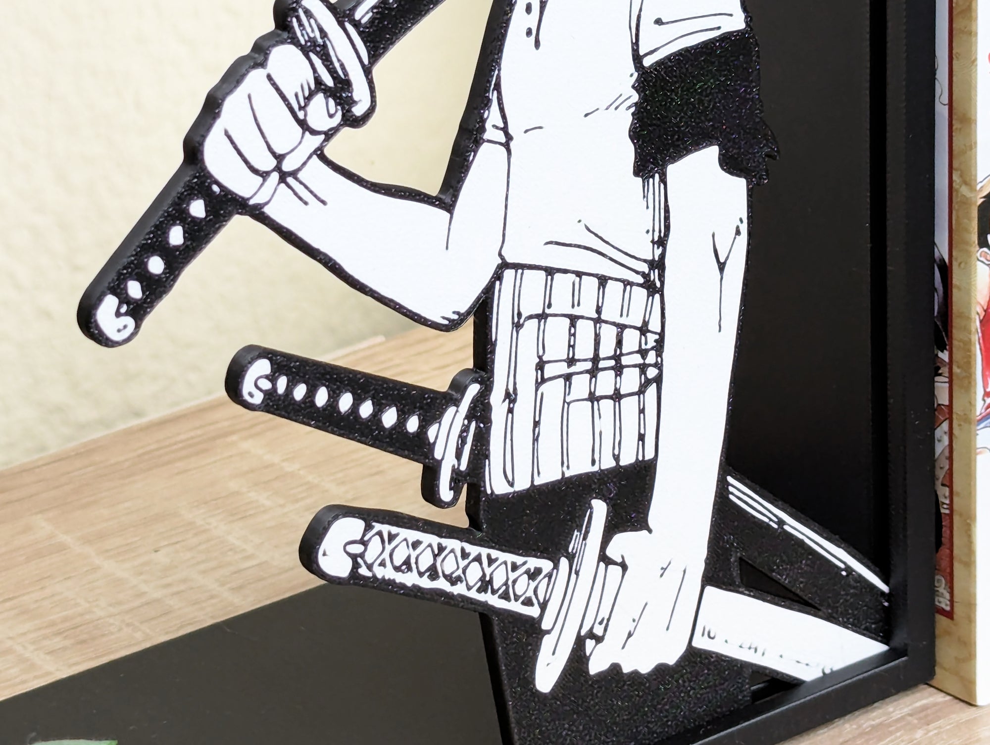 Sujetalibros de Zoro con las katanas