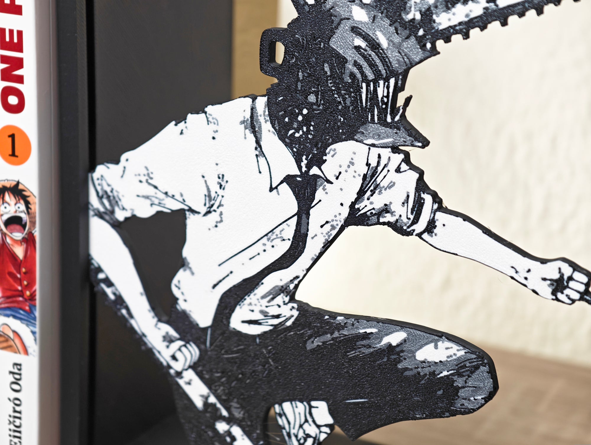 Sujetalibros de Chainsaw Man con las motosierras