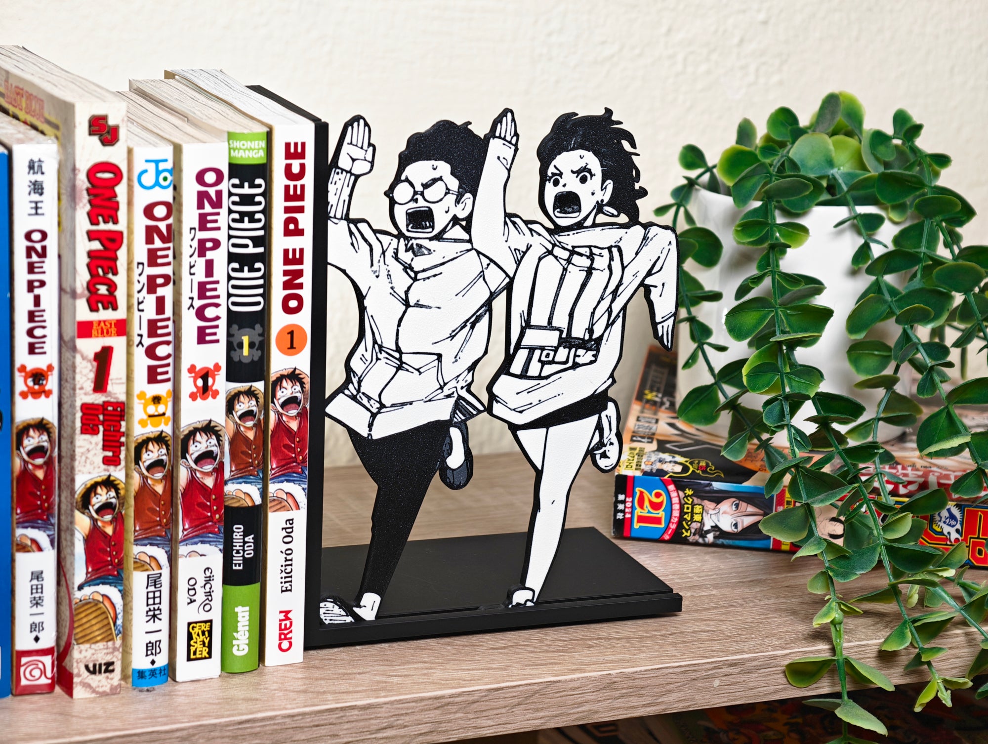 Sujetalibros de Momo y Okarun corriendo