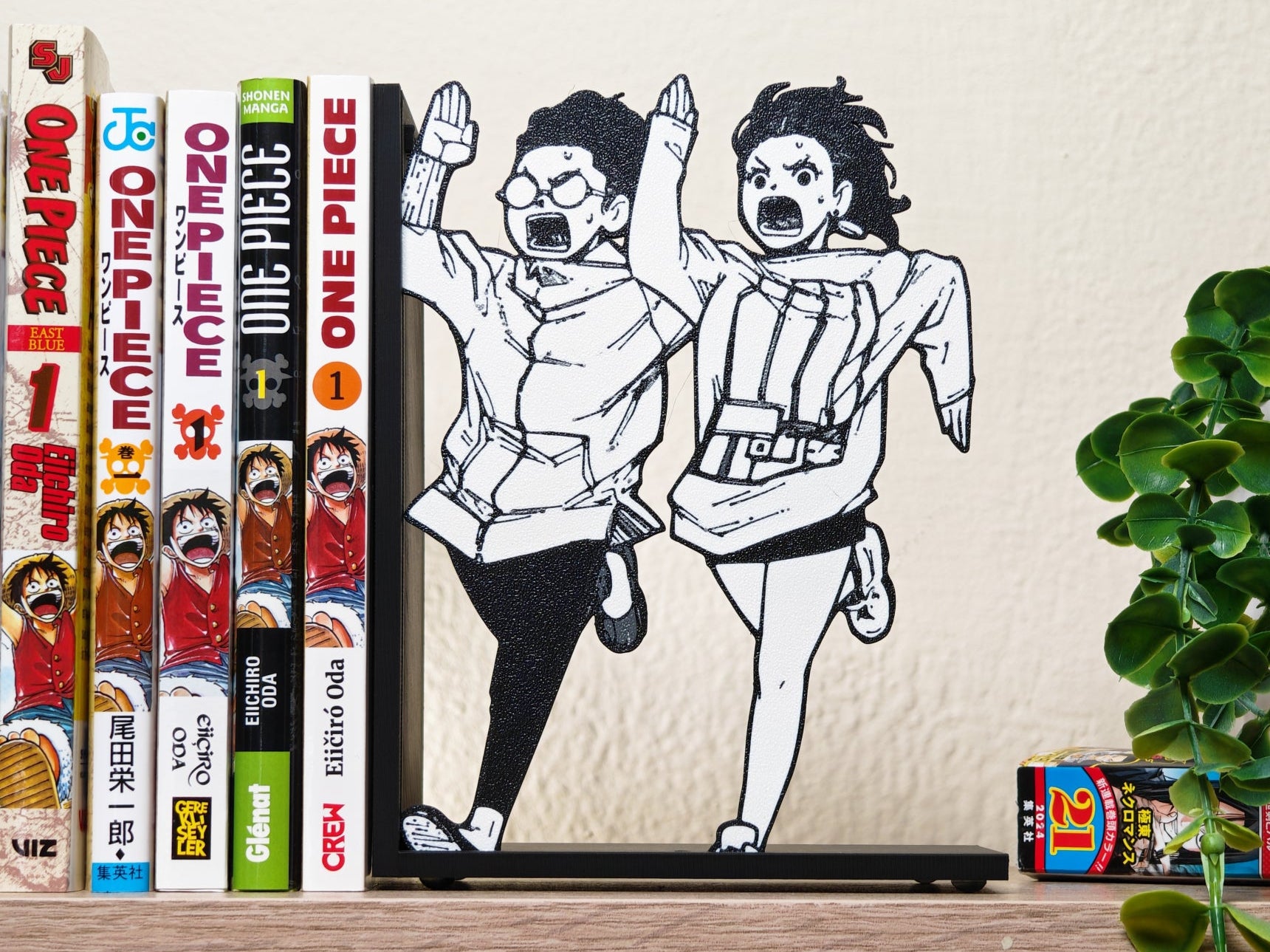 Sujetalibros de Momo y Okarun corriendo