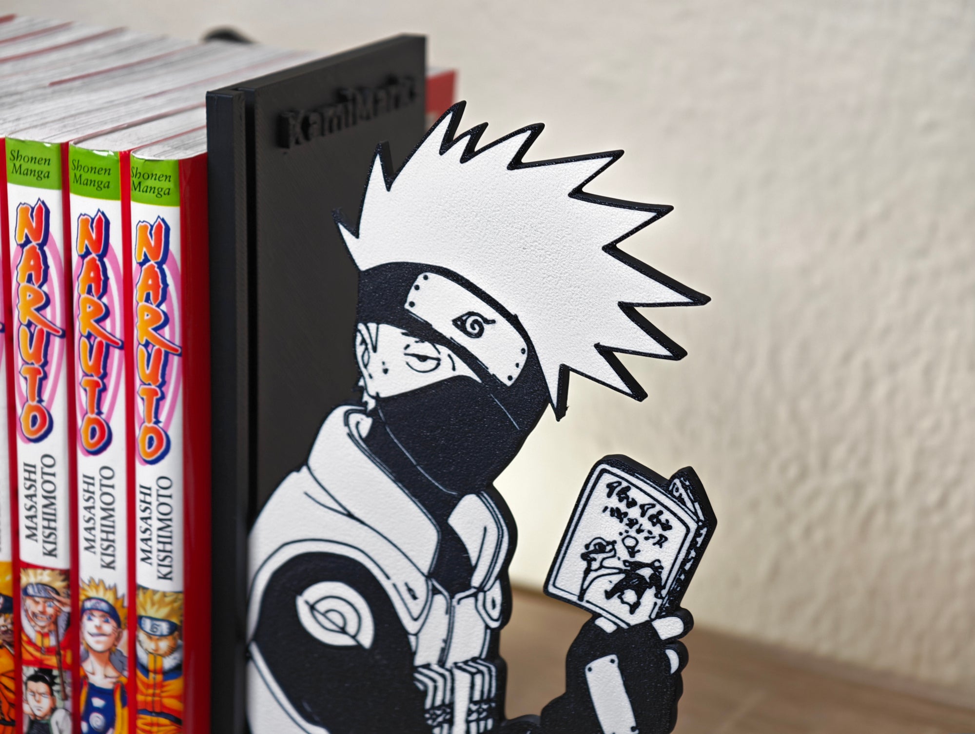 Sujetalibros de Kakashi leyendo