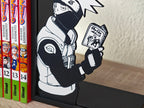 Sujetalibros de Kakashi leyendo