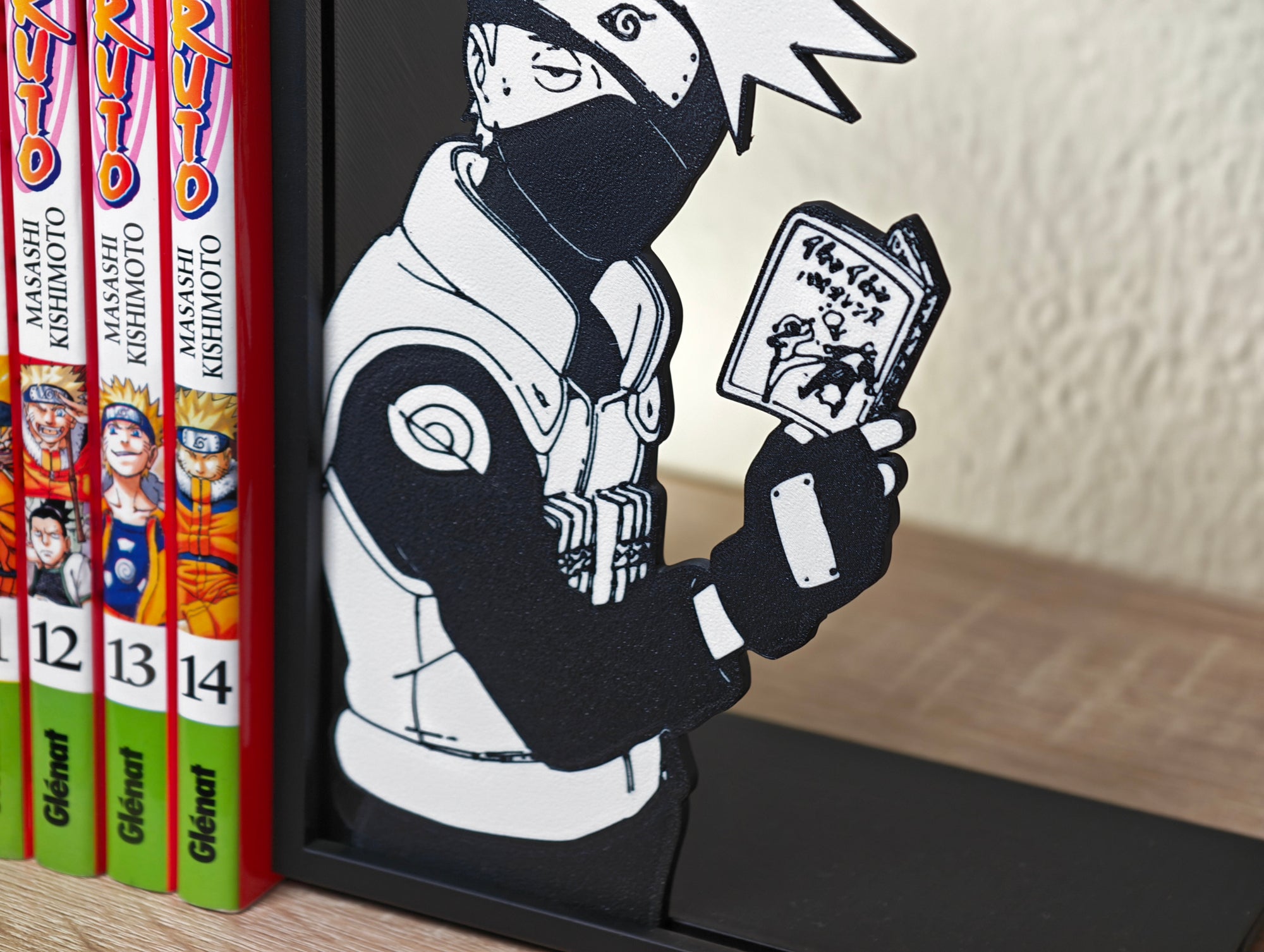 Sujetalibros de Kakashi leyendo
