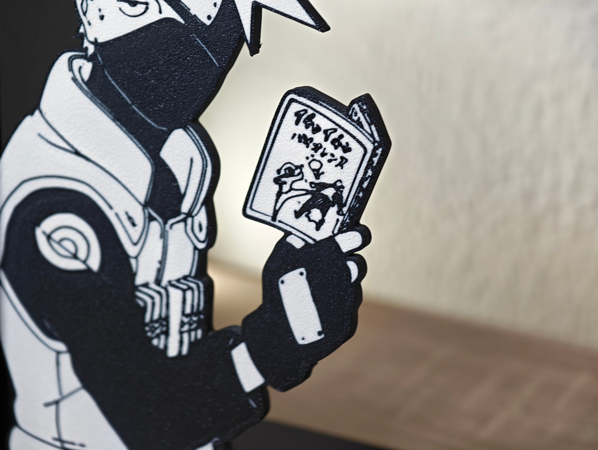 Sujetalibros de Kakashi leyendo