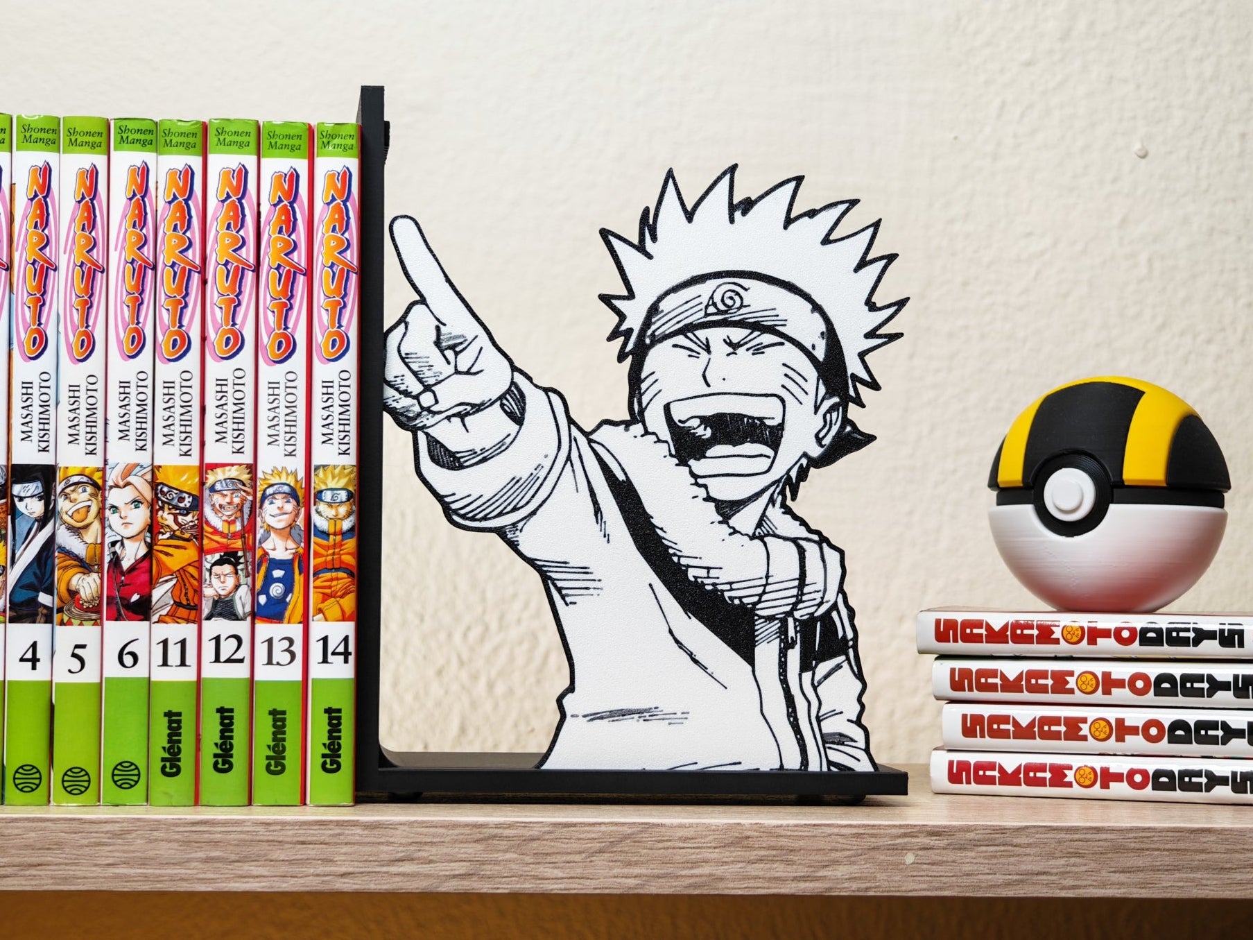 Sujetalibros de Naruto riéndose