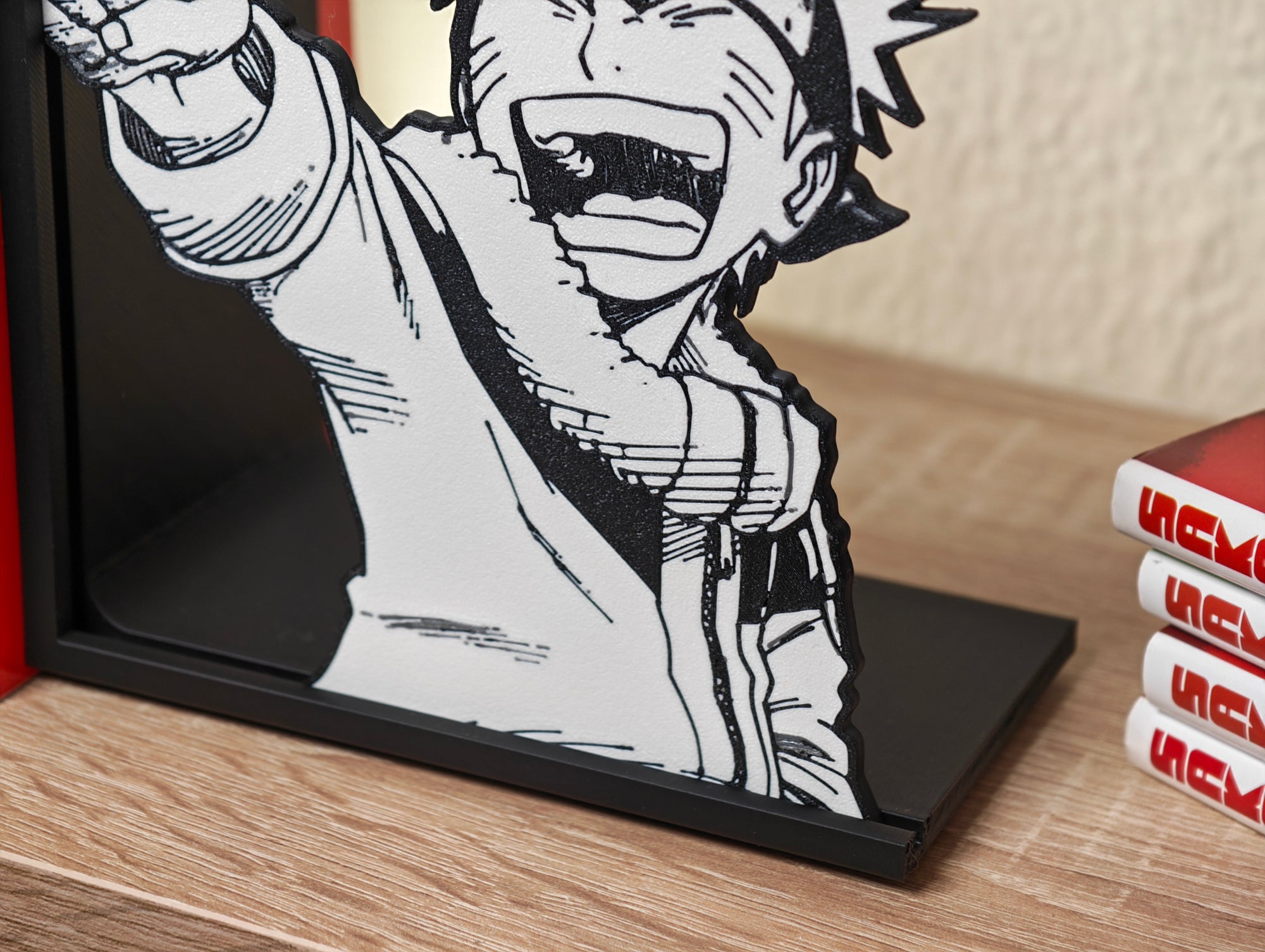 Sujetalibros de Naruto riéndose