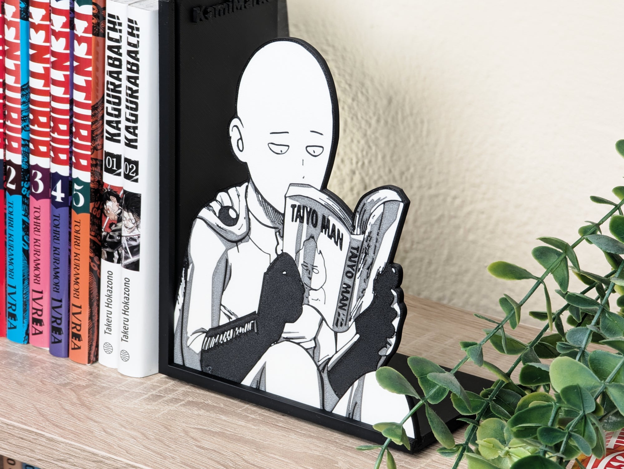 Sujetalibros de Saitama leyendo manga
