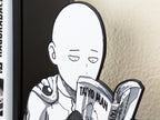 Sujetalibros de Saitama leyendo manga